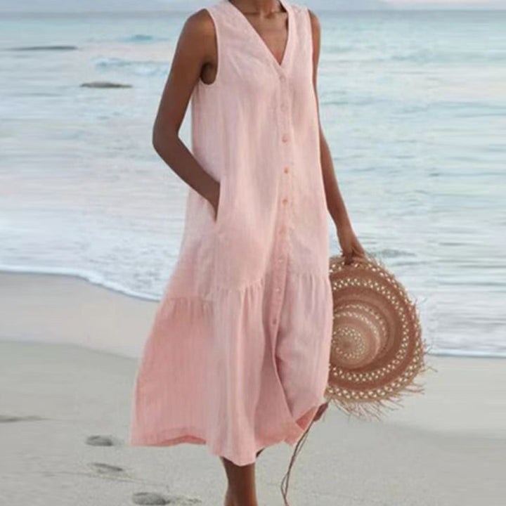 Women's elegant A-line midi dress with a flattering V-neck, sleeveless cut, button detailing, and useful pockets.