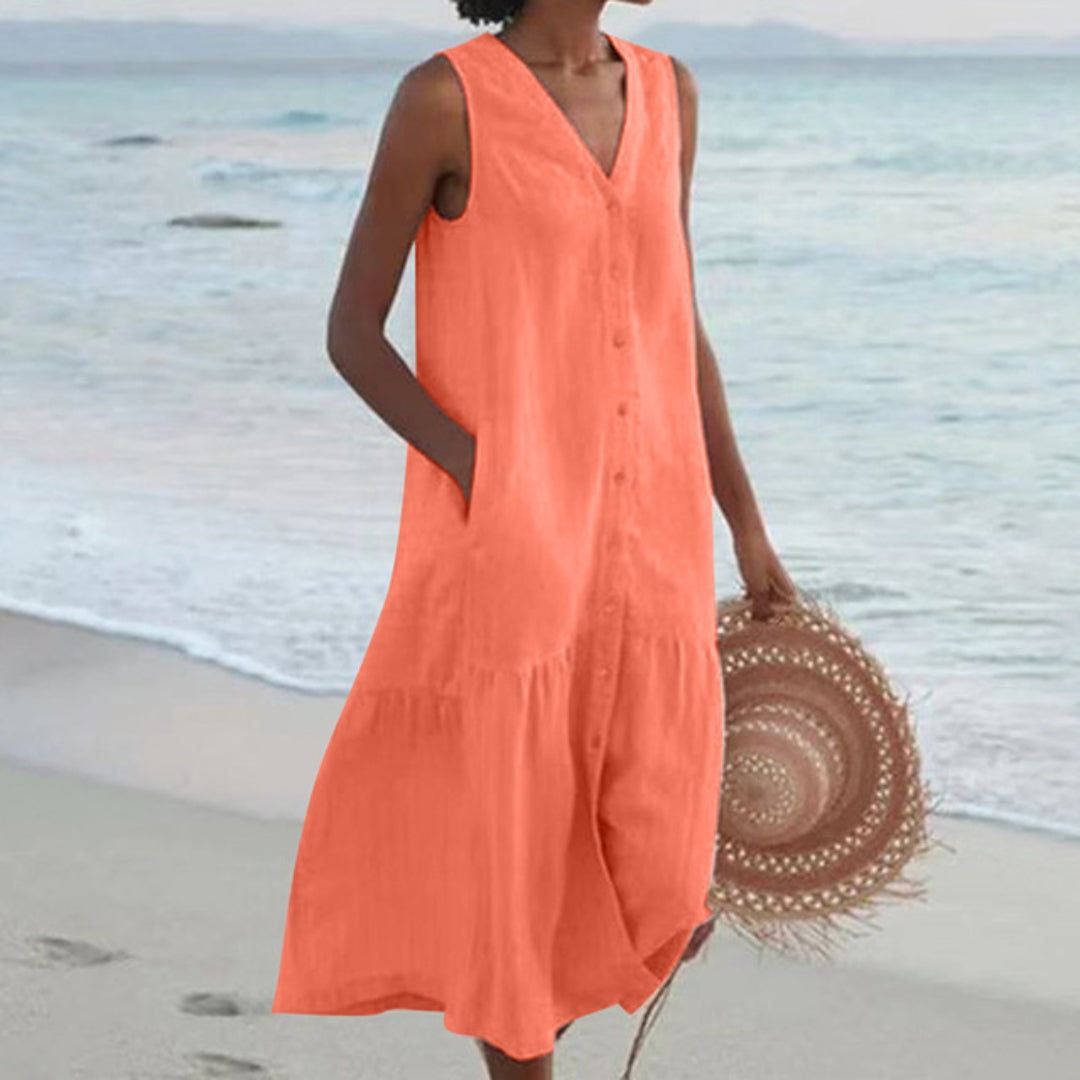 Everyday elegant A-line midi dress for women. Sleeveless, V-neck, button-down style with side pockets. Summer fashion.