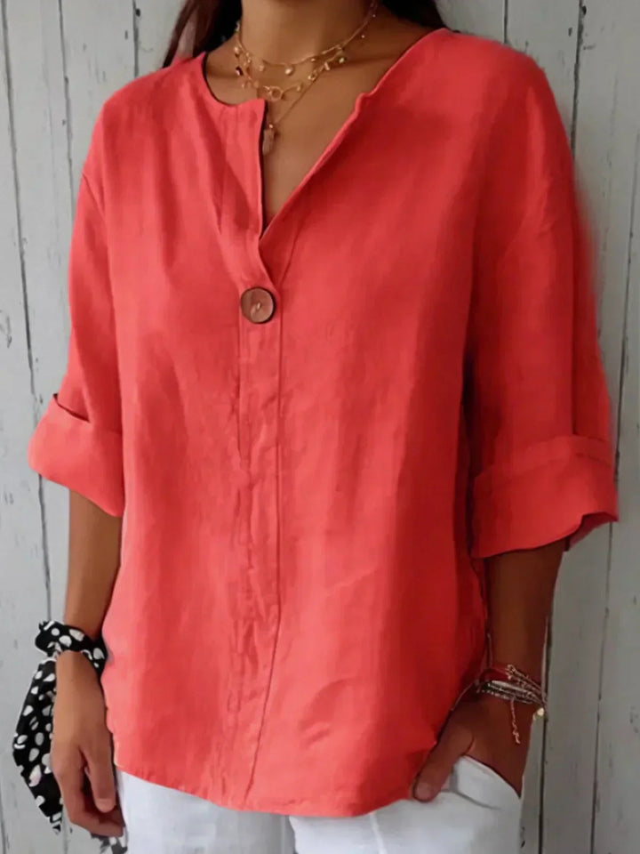 Casual chic women's button down shirt with 3/4 sleeves & V-neck, offering a comfortable, relaxed fit for any day.