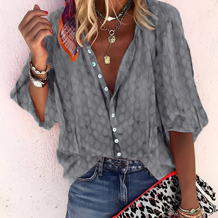 Women's effortless button-up blouse, relaxed loose fit, 3/4 sleeves, comfortable everyday chic top.
