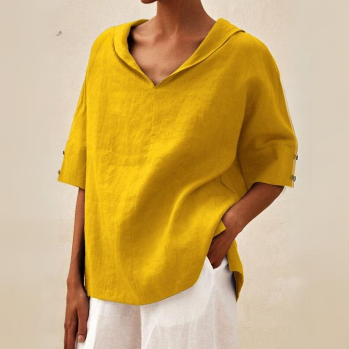 Elegant women's V-neck blouse, collared and short-sleeved. Comfortable for work or a stylish casual look.