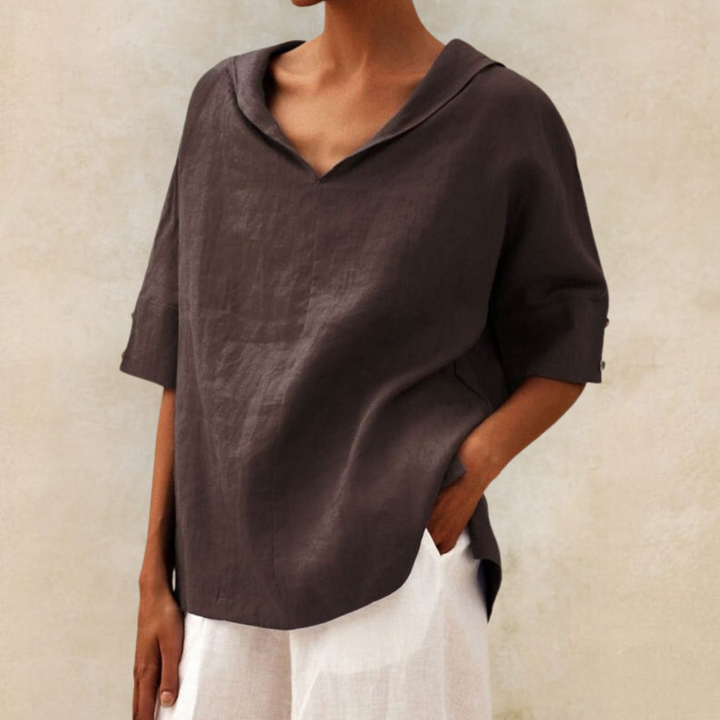 Lightweight short-sleeve V-neck blouse for women. Stylish collared top, ideal for summer fashion & everyday wear.