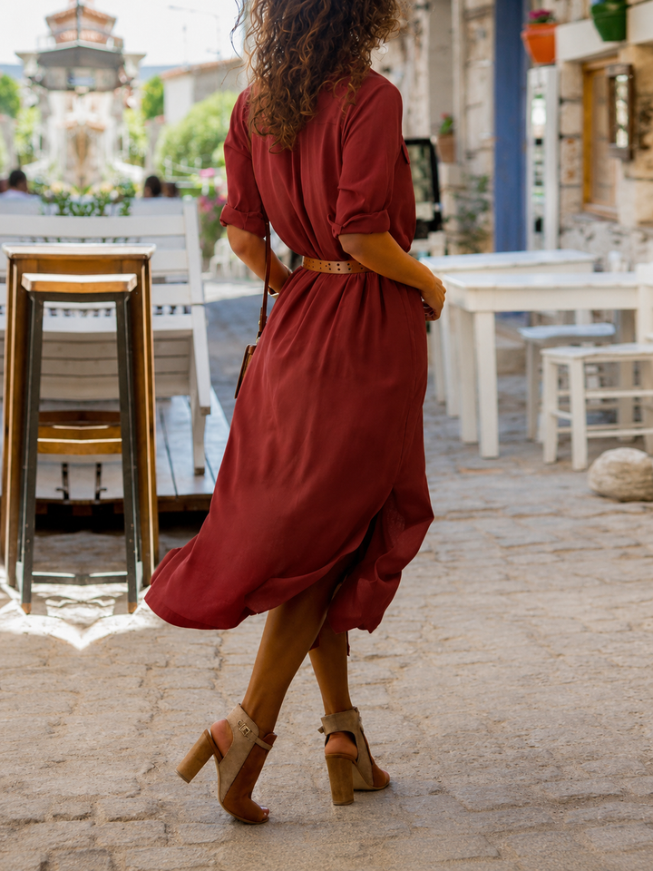 Lightweight women's midi shirt dress with an elegant belt, ideal for comfortable spring and summer fashion.