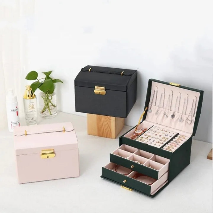 Multi-layer women's jewelry organizer box with compartments for earrings, rings, bracelets & watches storage.