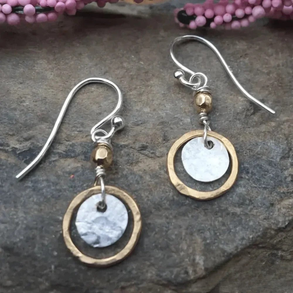Women's antique gold & silver dual-tone hoop earrings, mixed metal vintage style elegant fashion accessory.
