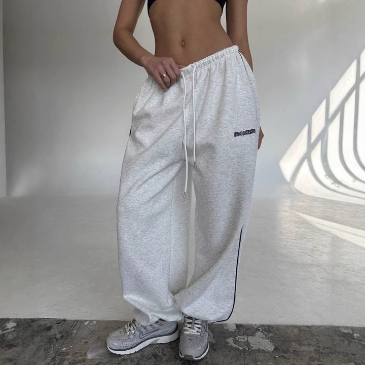 Athleisure style: women's drawstring sweatpants with a trendy side stripe.