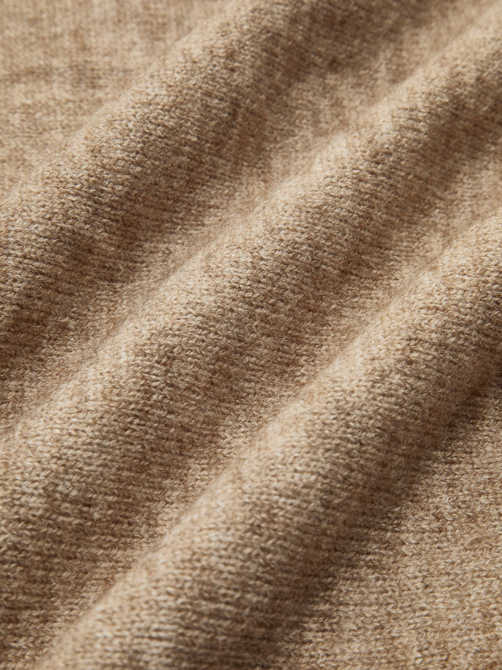 Woman relaxing in a soft knit beige lounge set, perfect for cozy evenings