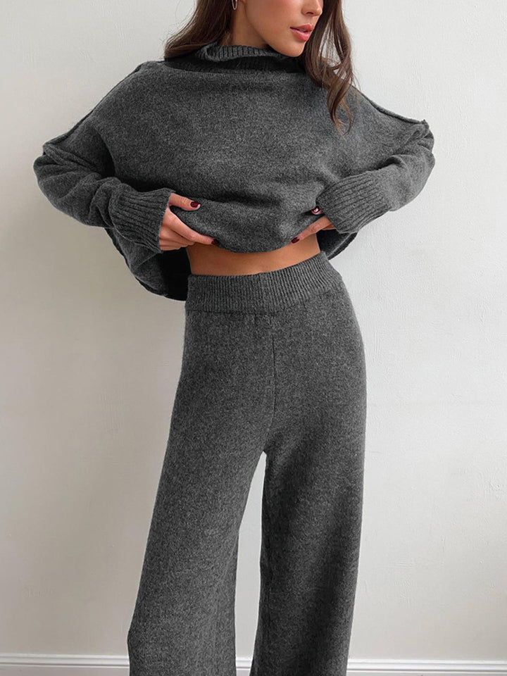 Full view of the women's red knitwear set: turtleneck top and matching pants