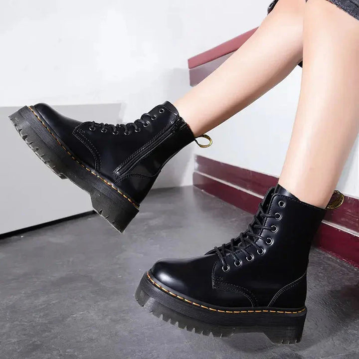 Bold women's platform lace-up boots. Chunky black ankle boots, a trendy fashion statement for assertive style.