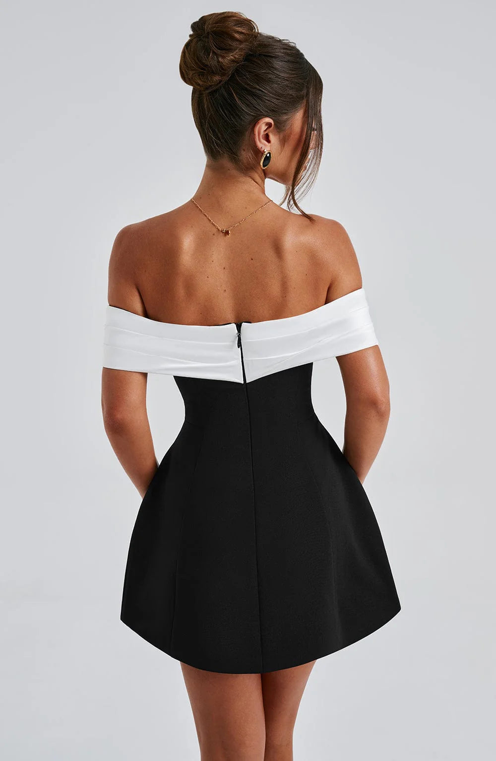 Short black evening dress with an alluring bardot collar