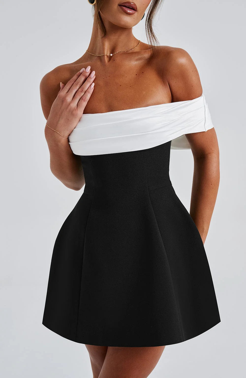 Elegant women's black mini dress with flattering bardot neckline