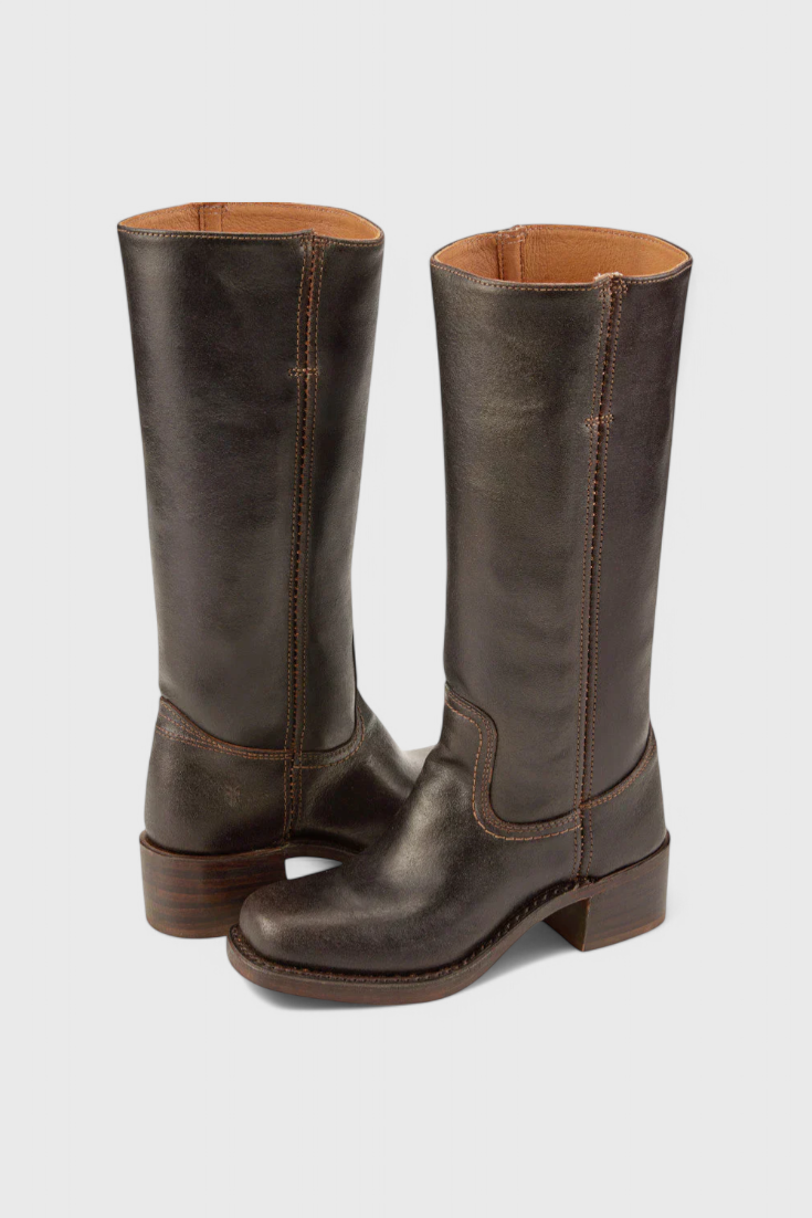 Durable women's knee high boots with a stacked heel, suitable for winter adventures.