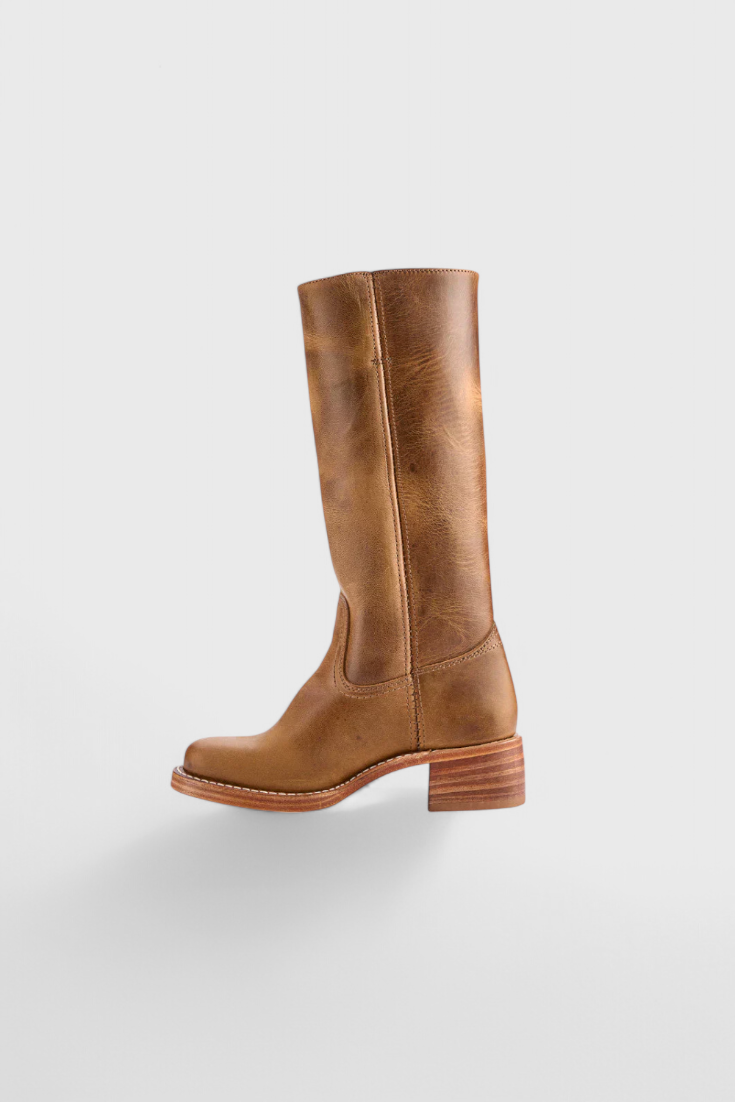 Warm winter boots for women: knee high design with a chic stacked heel.