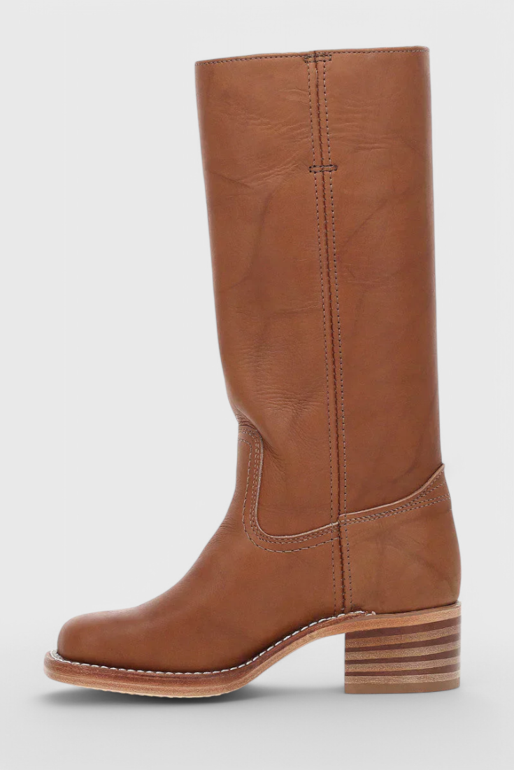 Fashionable cowgirl style knee high boots for women, showcasing a sturdy stacked heel.