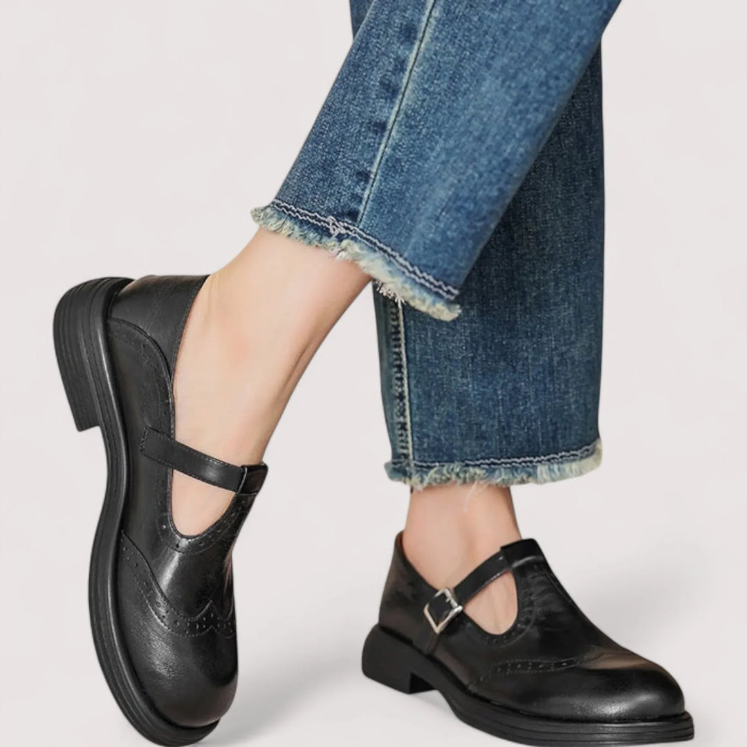 Side view of women's orthopedic Mary Jane shoes in a classic black finish.