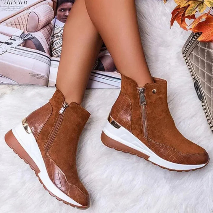Women's black waterproof ankle boots with side zipper for easy wear.