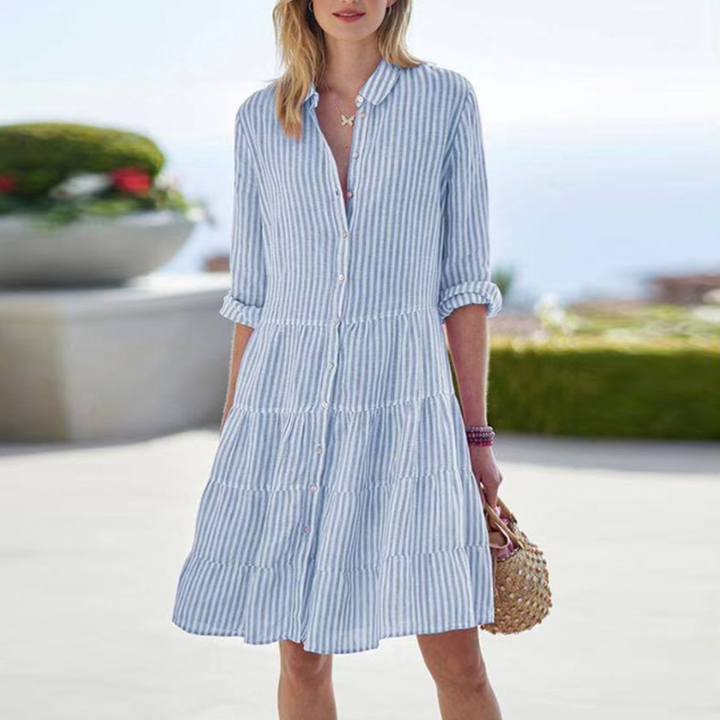 Chic women's short-sleeve midi dress in a striped pattern, ideal for summer outings and travel.