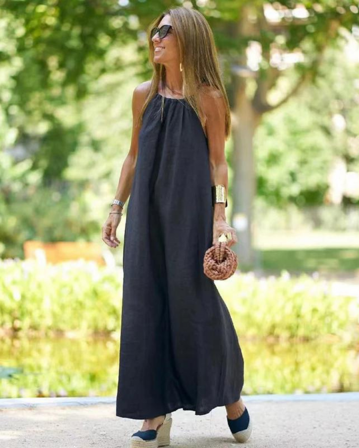 Flowy sleeveless halter neck maxi dress for women, perfect for summer beach vacations