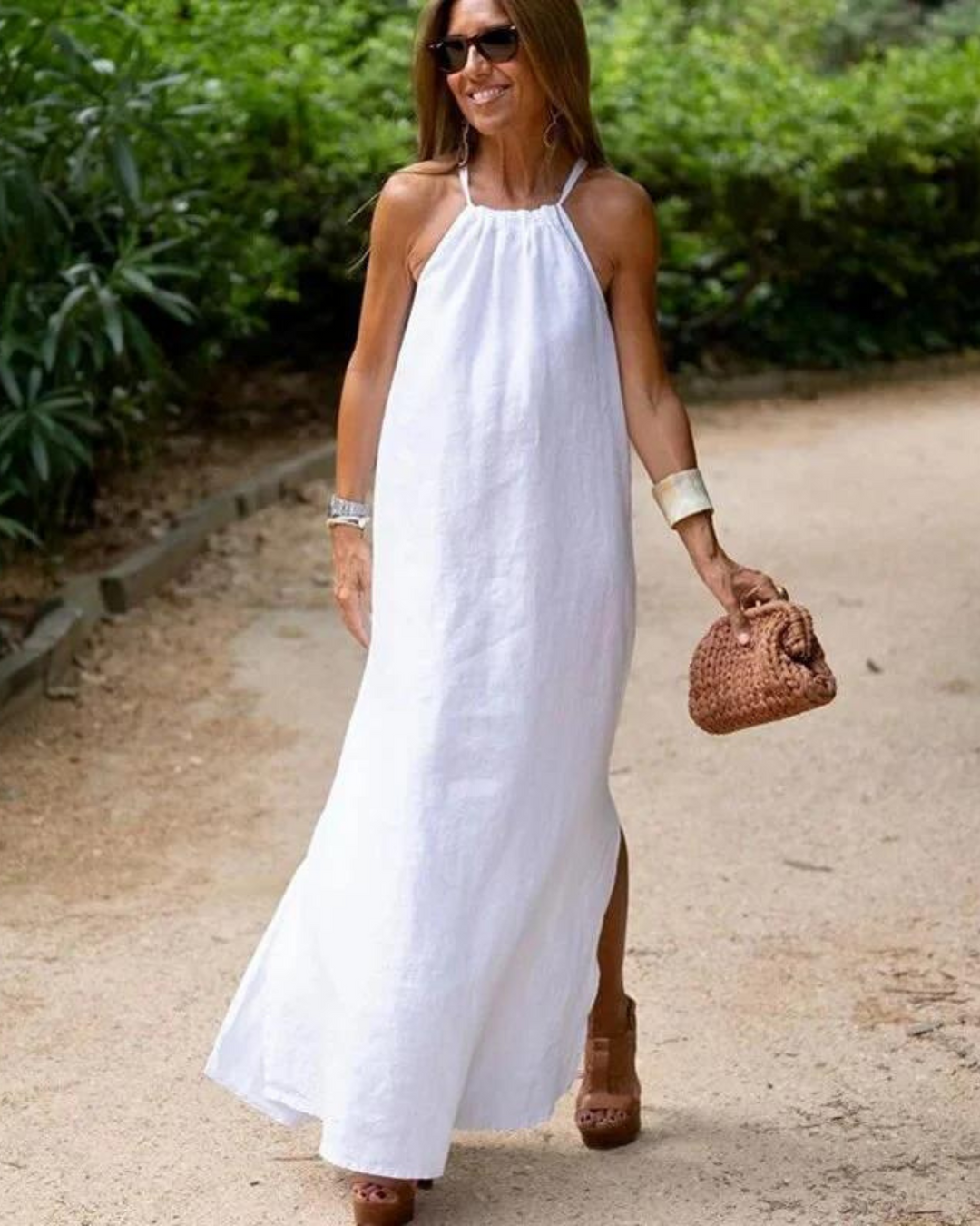 Sleeveless flowy halter neck maxi dress, a chic summer and beachwear option for women