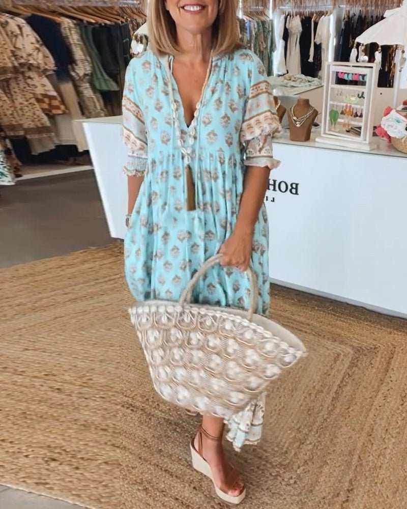 Side view of the elegant green floral midi dress, showing its drape.