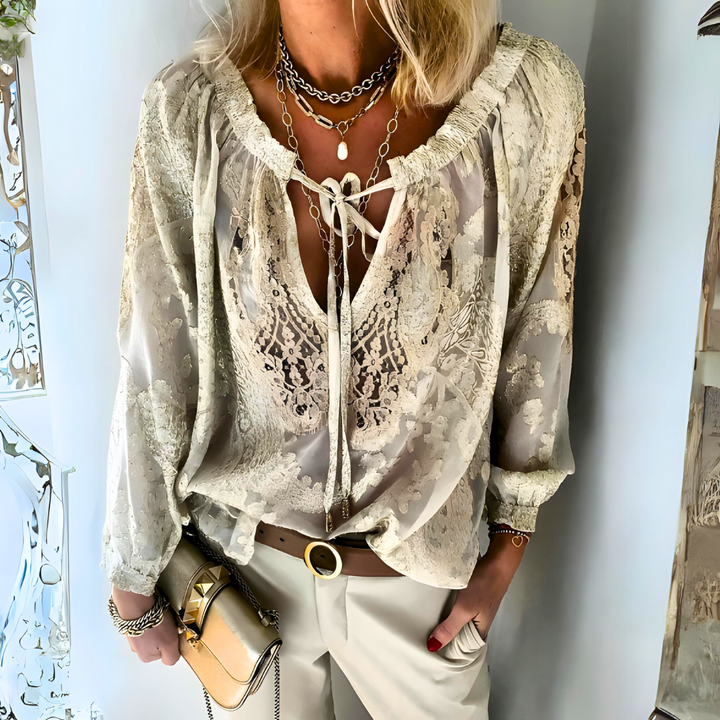 Women's bohemian crochet blouse with intricate artisanal detailing, perfect for summer style.