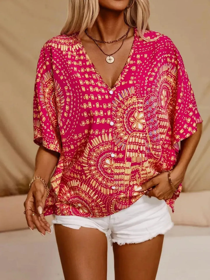Vibrant floral print blouse with a flattering v-neck for women