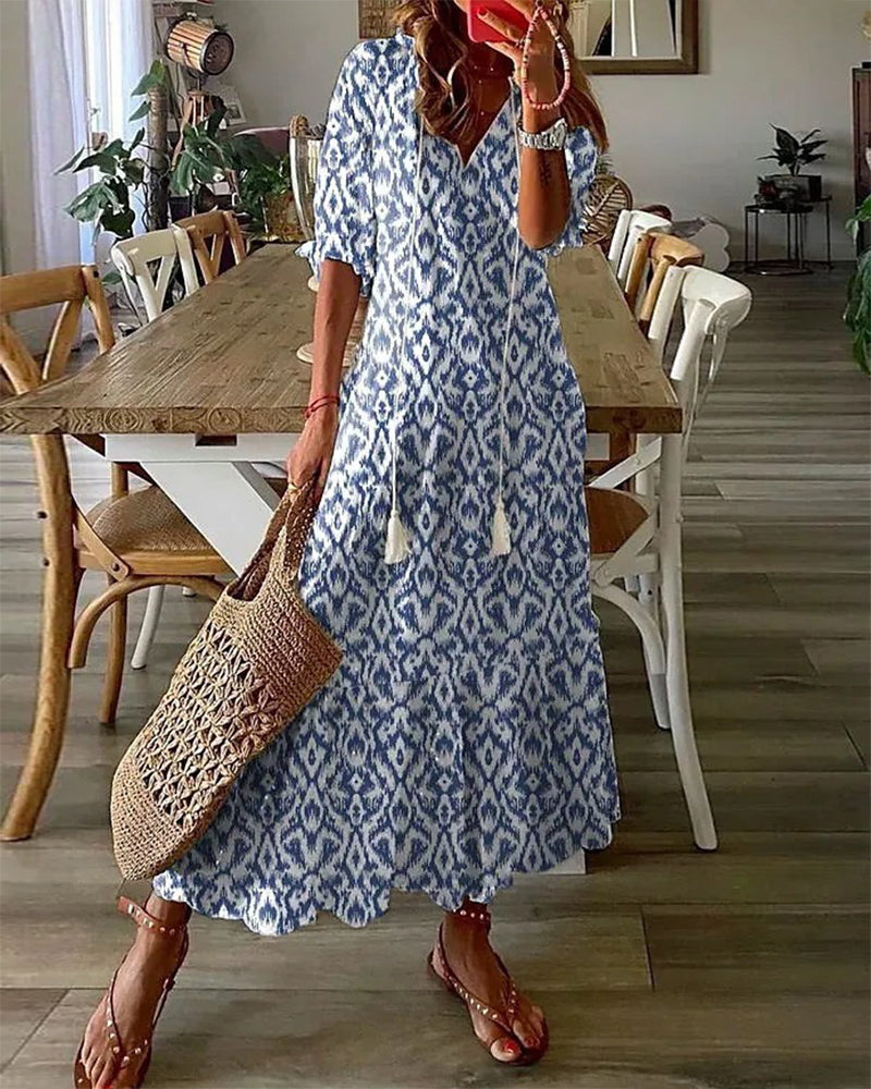 Women's boho vintage V-neck printed maxi dress, perfect for summer.