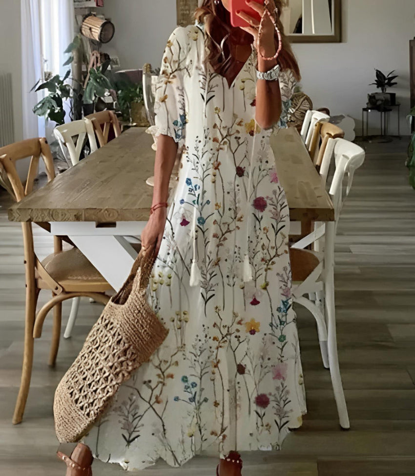 Fashionable women's boho vintage V-neck dress with vibrant print, a spring essential.
