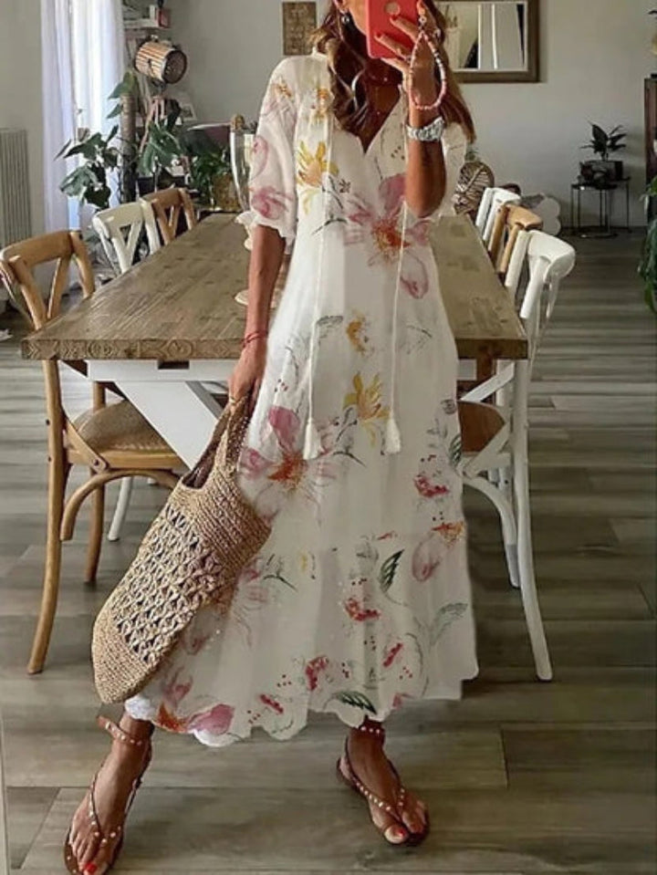 Relaxed fit women's boho V-neck maxi dress featuring a beautiful vintage print.