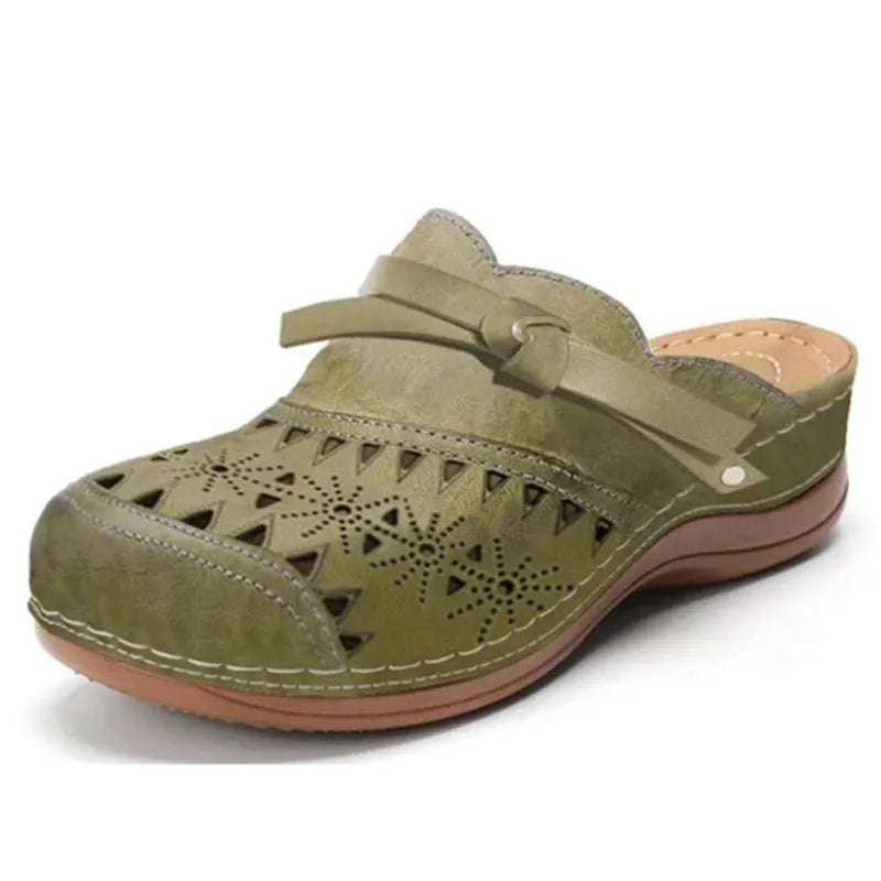 Comfortable women's slip-on sandals, ideal for casual summer outfits. Features charming bow and cutout details.