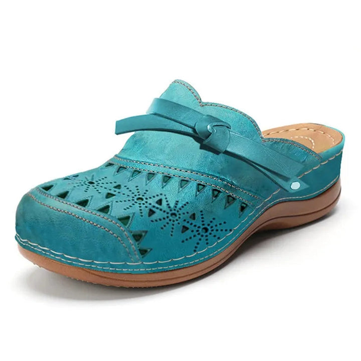 Unique women's backless clogs, designed with a chic bow accent and eye-catching cutout patterns. Perfect summer shoes.