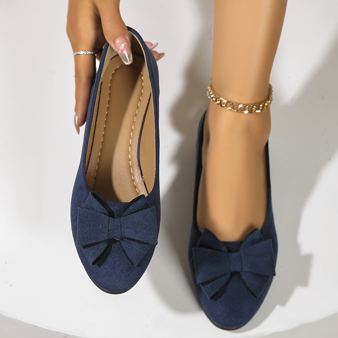 Women's slip-on wedge ballet flats with bow, comfortable and elegant for casual everyday wear.