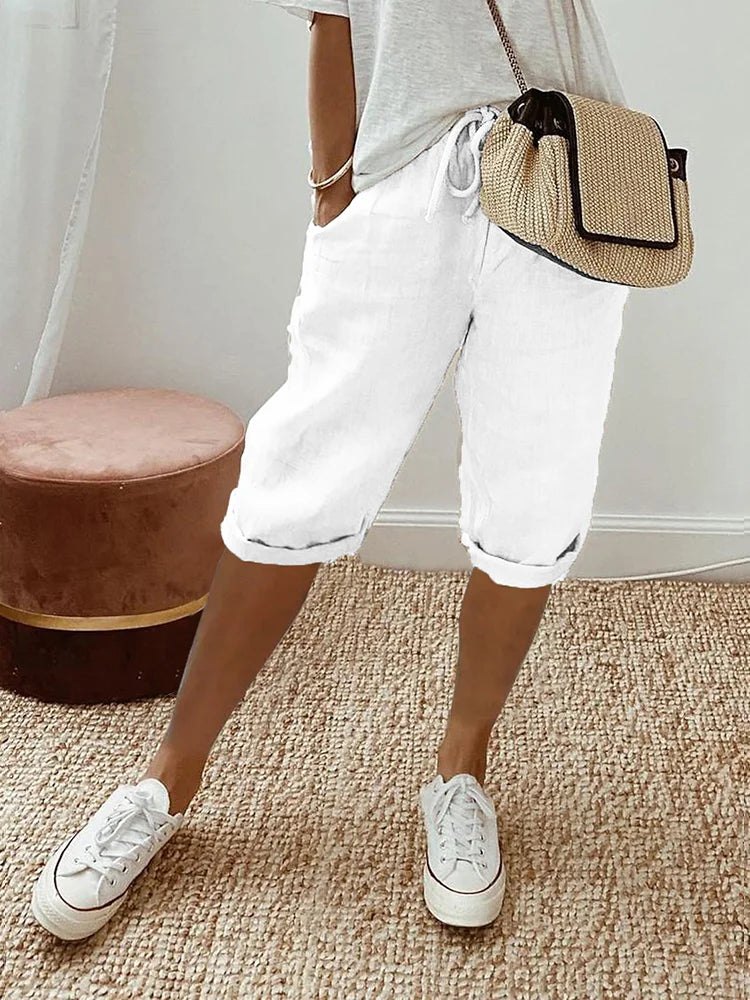 Versatile women's knee-length activewear pants with adjustable waist, perfect for casual comfort or workouts.
