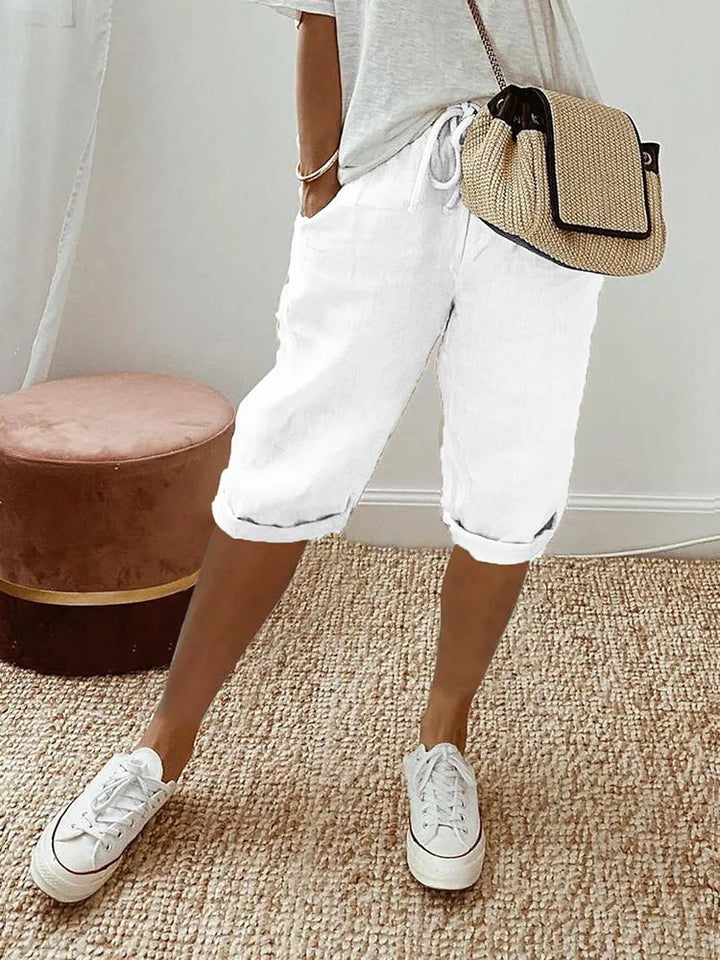 Versatile women's knee-length activewear pants with adjustable waist, perfect for casual comfort or workouts.