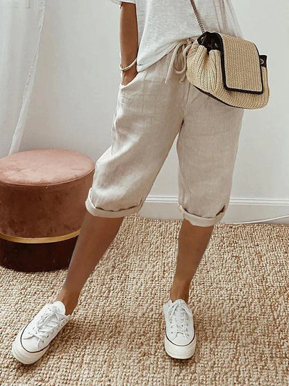 Black women's breathable knee-length pants, relaxed fit capris with adjustable waist for summer comfort.