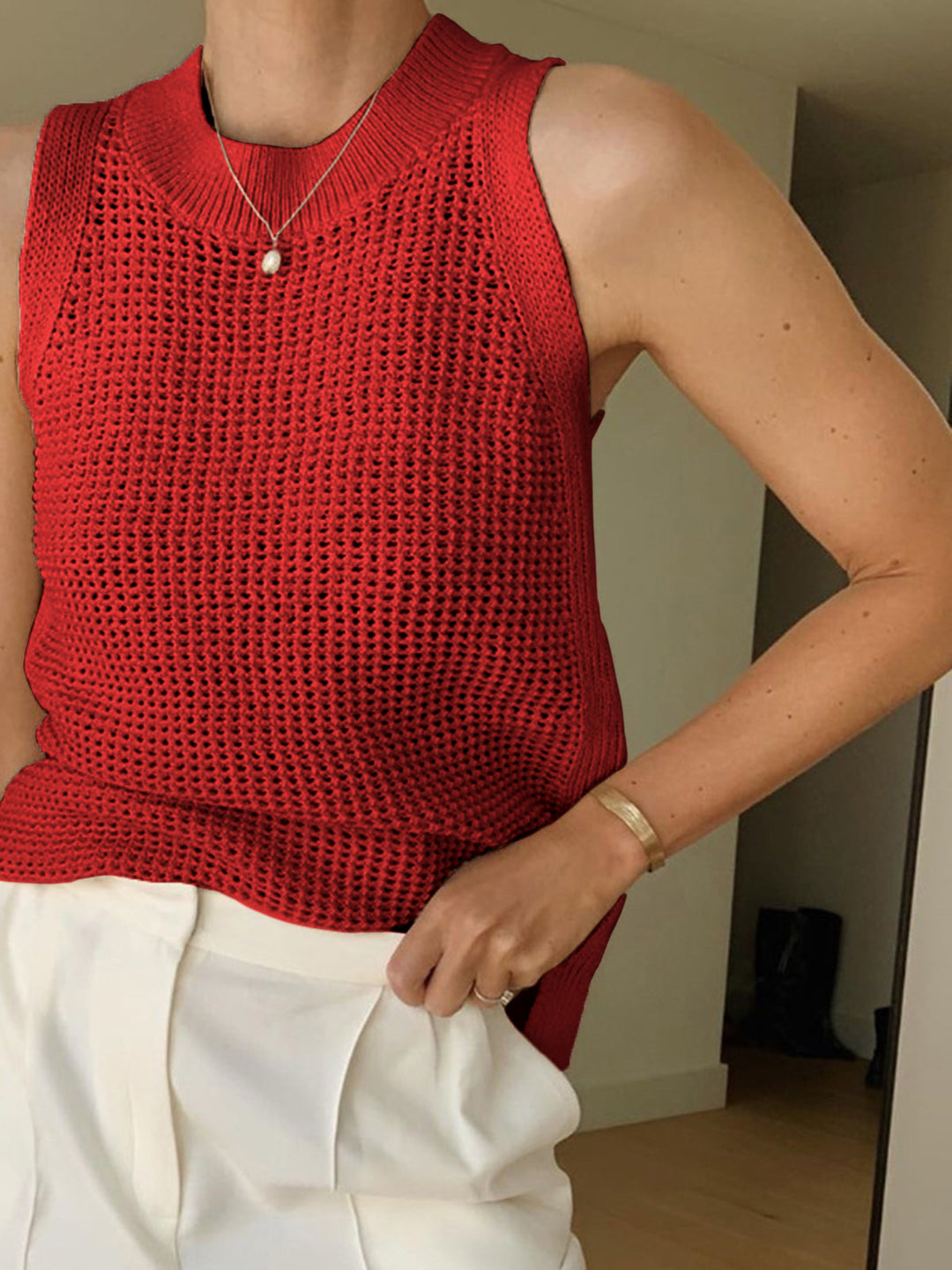Versatile women's sleeveless hollow top. Lightweight, breezy summer tank for casual or chic fashion.
