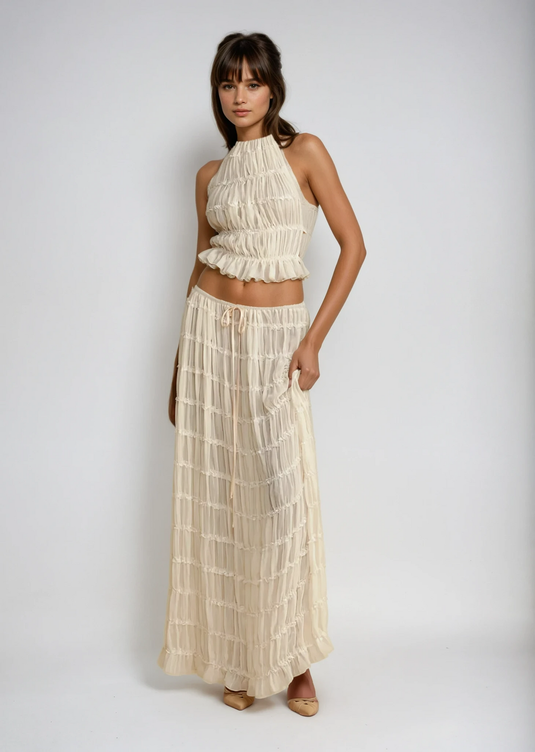 Women's breezy two-piece summer set with halter top & maxi skirt, comfortable and stylish.