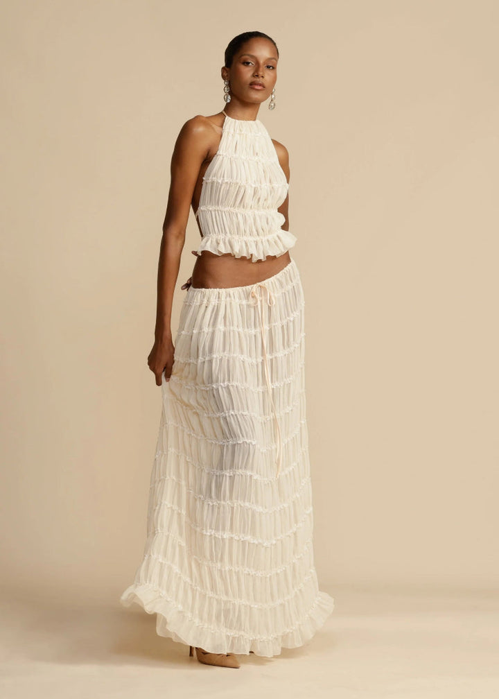 Comfortable & breezy women's two-piece summer set, halter top and flowy maxi skirt for warm days.