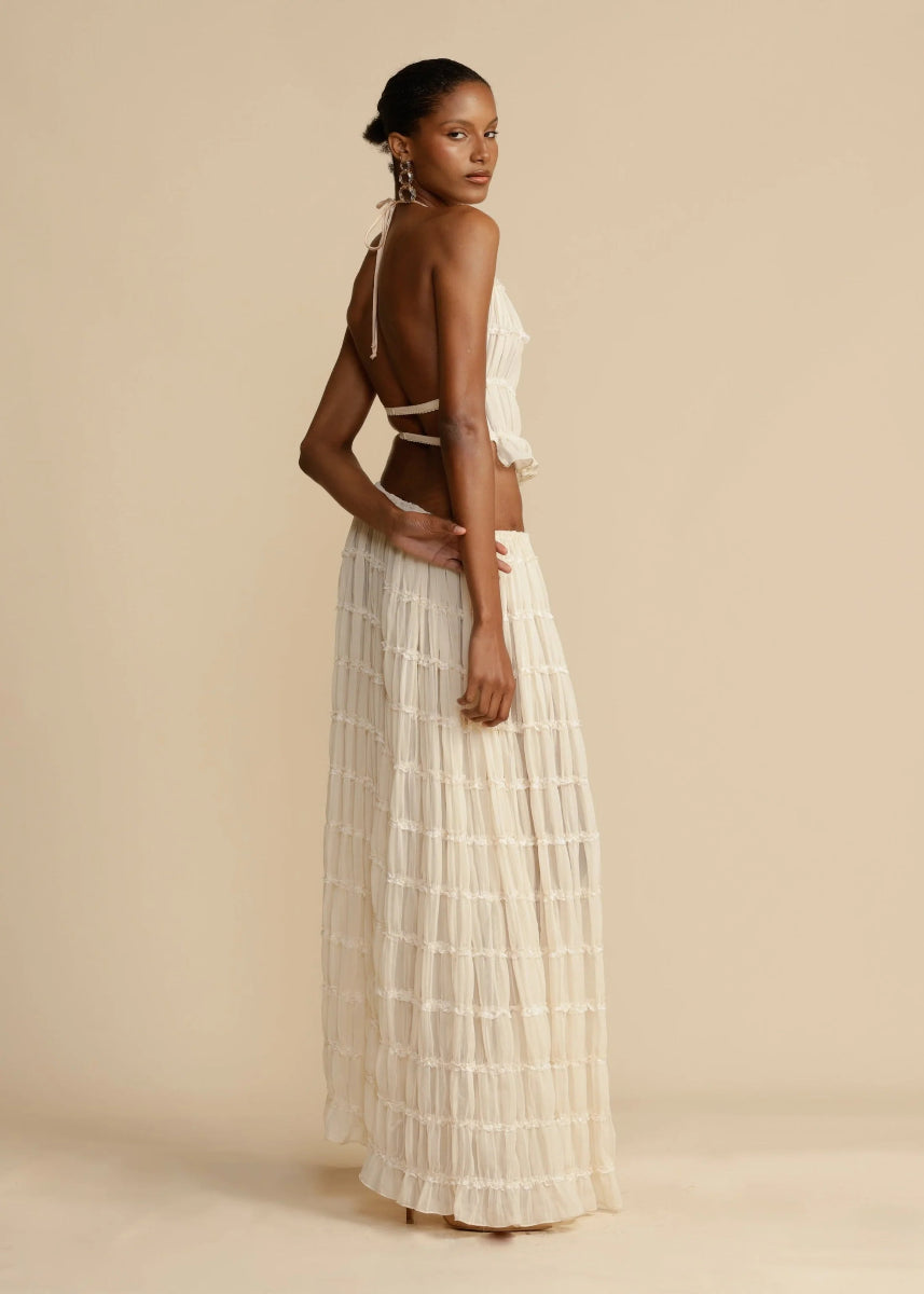 Women's summer two-piece set featuring a comfortable halter top and a long, flowy maxi skirt.