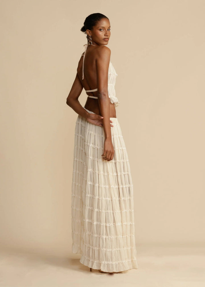 Women's summer two-piece set featuring a comfortable halter top and a long, flowy maxi skirt.