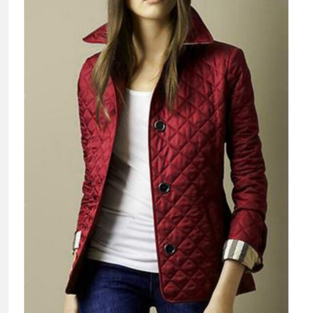 Plus size women's lightweight quilted jacket. Ideal button-down outerwear for fall and mild winter style.