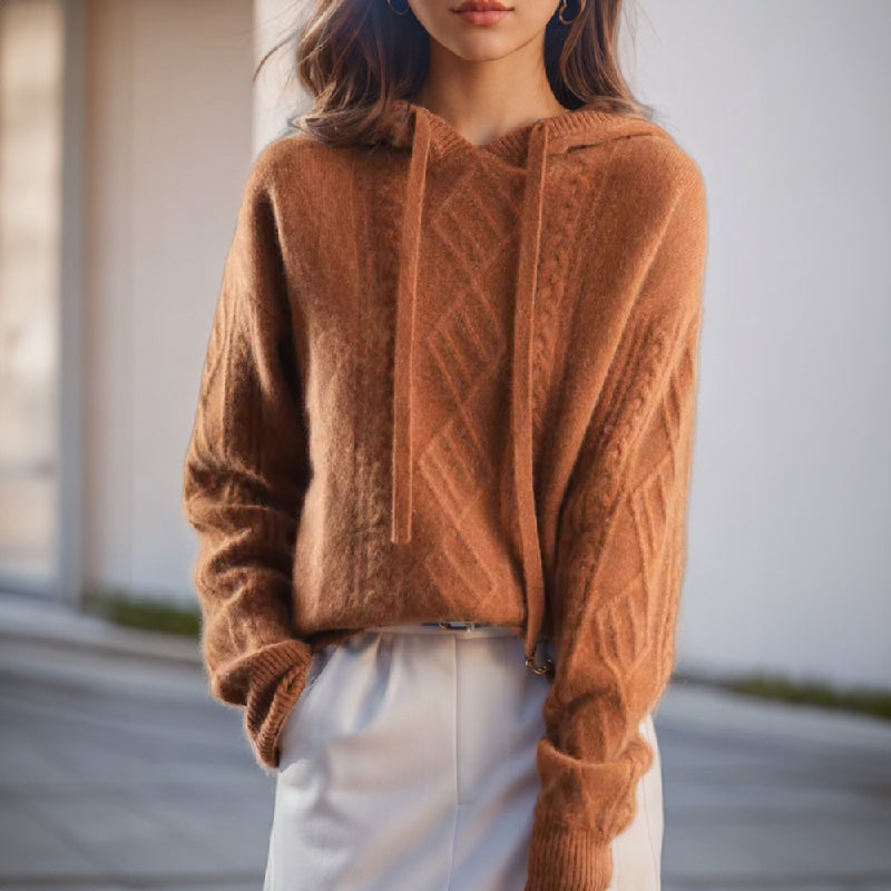 Women's cozy cable knit hooded pullover in a relaxed fit, perfect for autumn and winter everyday style.