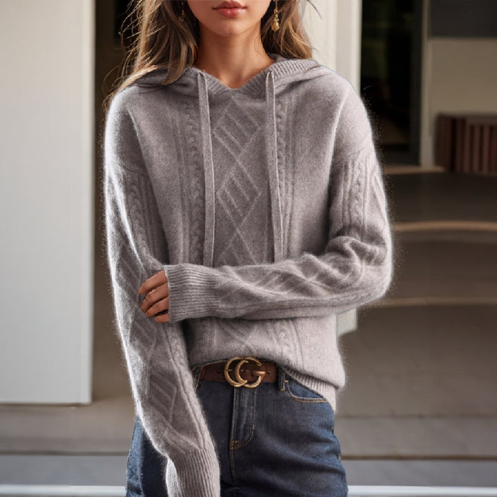 Chic women's hooded cable pullover top for versatile casual wear. Ideal layering piece for autumn fashion.