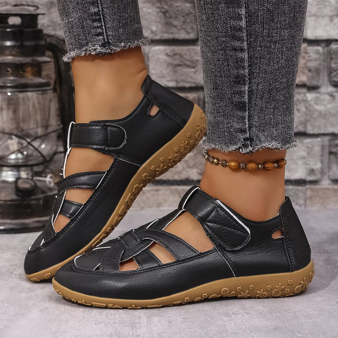 Women's casual cutout sandals with adjustable velcro straps for summer comfort.