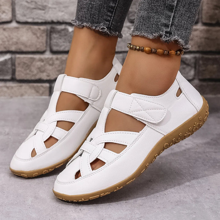 Comfortable everyday women's sandals with secure velcro straps and elegant cutout details.