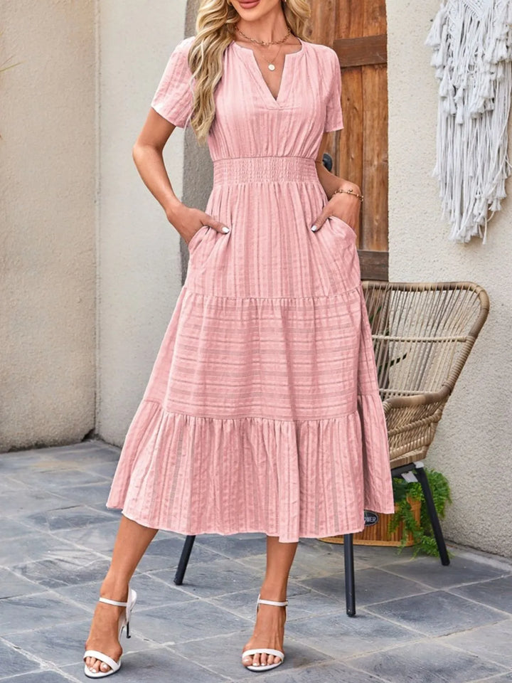 Women's casual flowy midi dress in a vibrant floral print, perfect for summer.