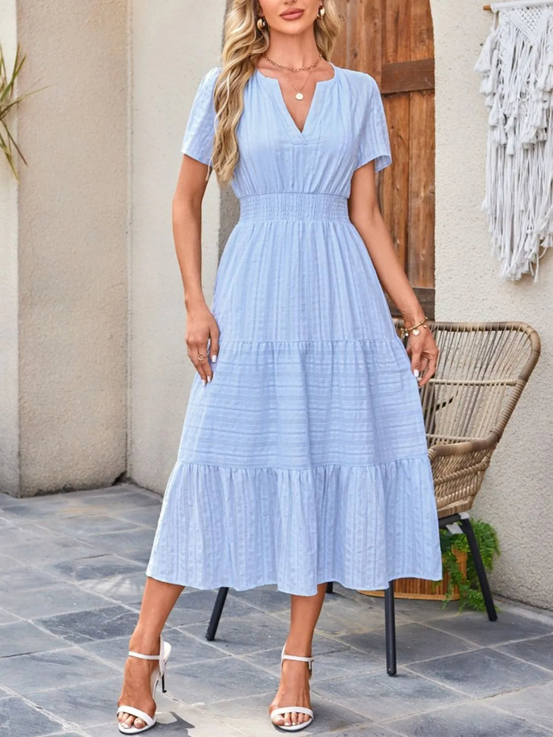 Elegant flowy midi dress for women, suitable as a wedding guest or work dress.