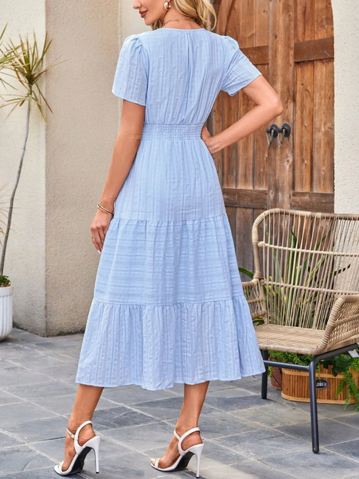 Comfortable casual midi dress with a relaxed fit and flattering silhouette.