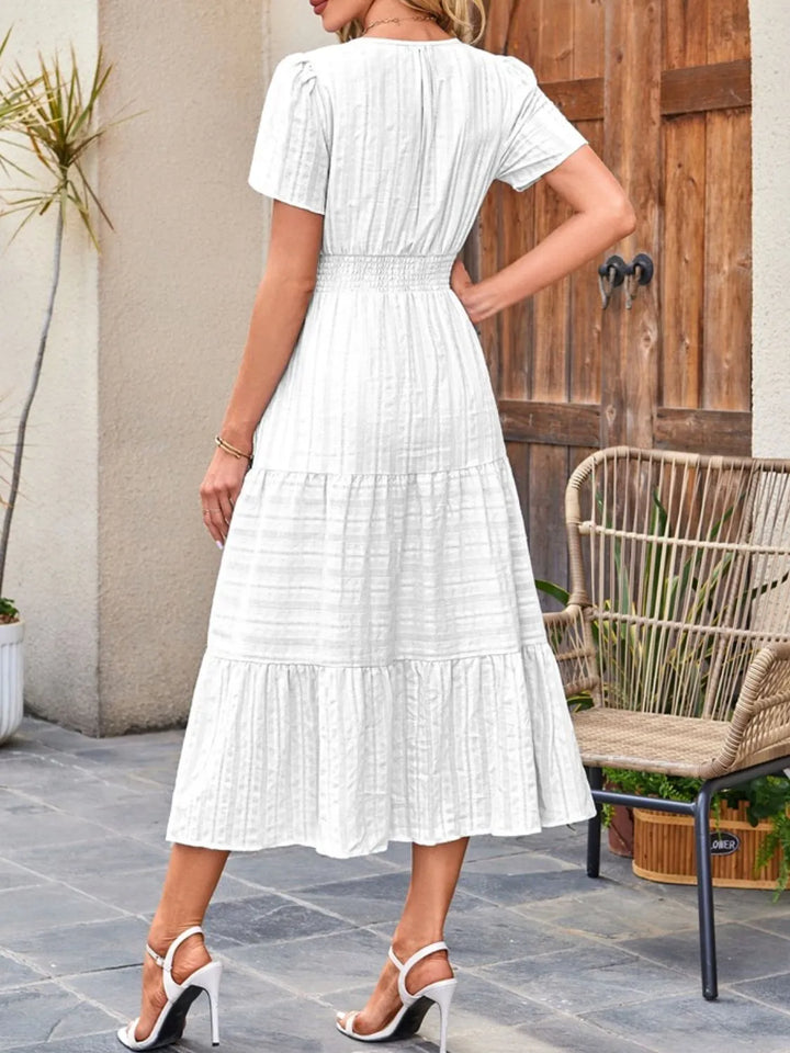 Chic and comfortable short sleeve midi dress with deep side pockets.