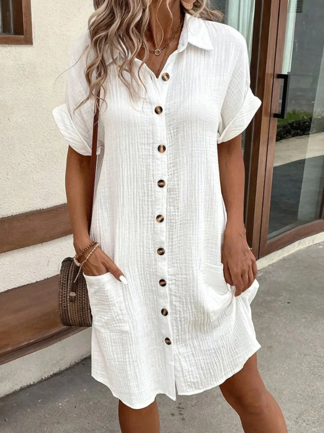 Front view of a relaxed fit button-down shirt dress for women